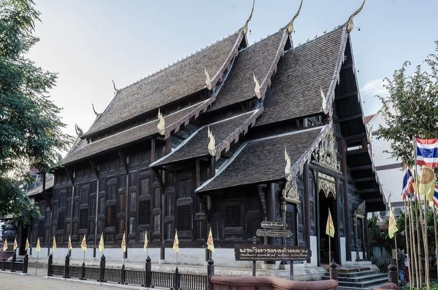 The dark teak viharn of Wat Phan Tao.