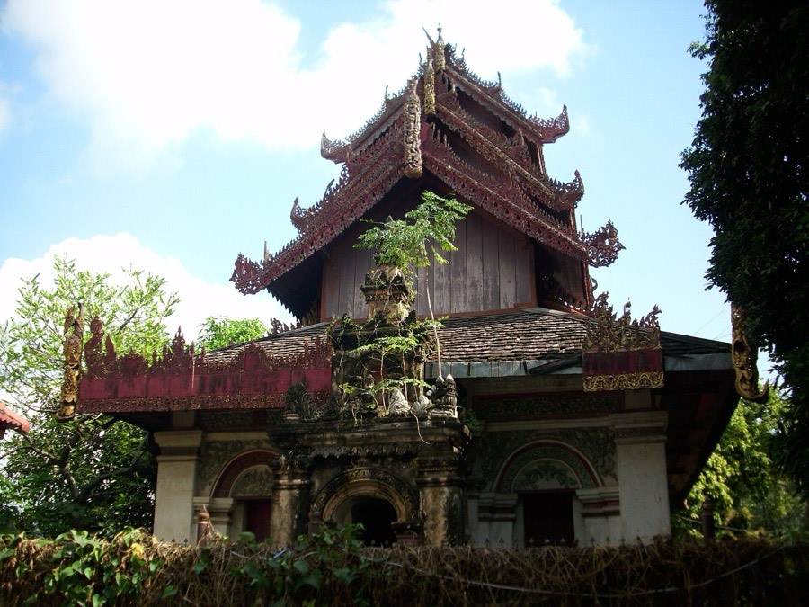 A Shan pavilion with tiered roofs on a brick base.