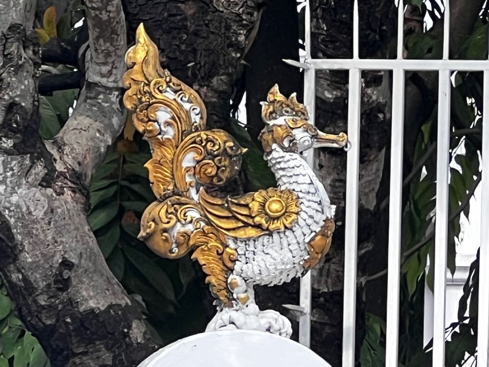 A gilded hamsa on a gatepost, round the corner on Thai Wiwat Alley