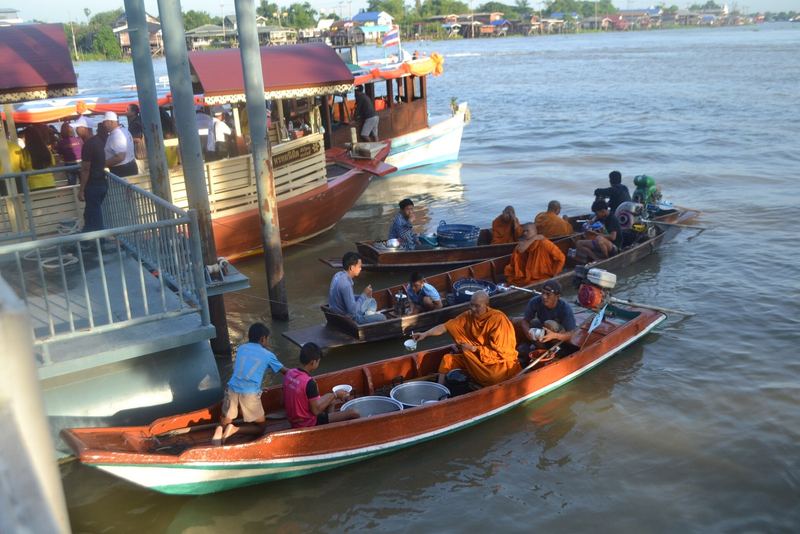 Boat alms at Wat Samlae