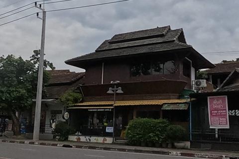 Lanna-style wooden house across the road