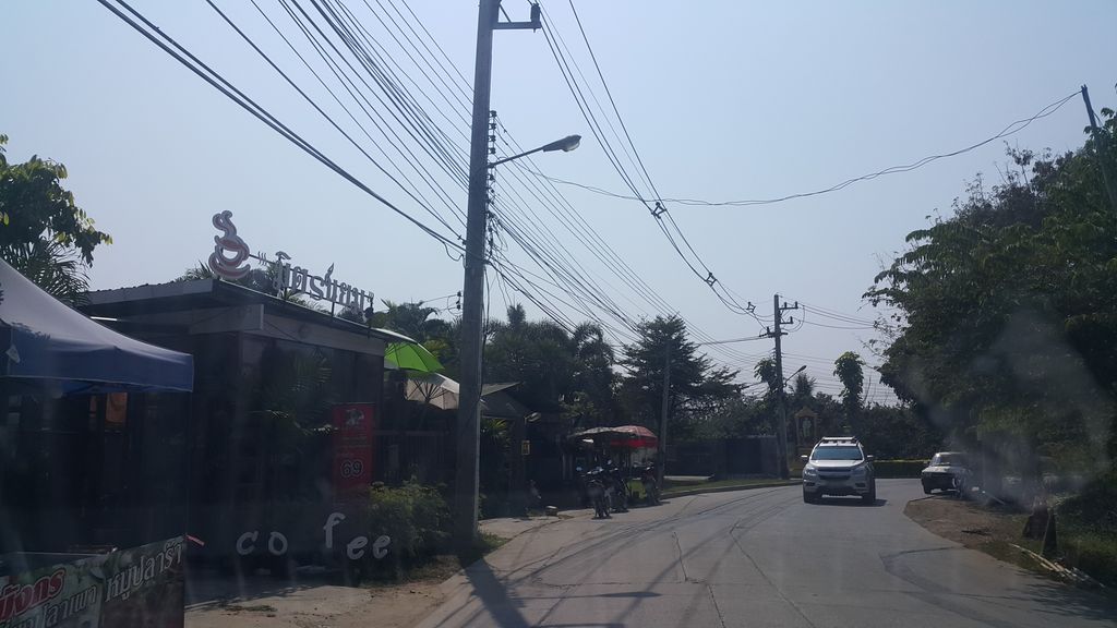 ภาพถนนตรงที่ กาแฟมิตรนิยม สาขาหมู่บ้านกาญจน์กนก น้ำโฮม ตั้งอยู่ ถ่ายโดย jrcarlsen พ.ศ. 2562 (2019) · A street-level view of where กาแฟมิตรนิยม สาขาหมู่บ้านกาญจน์กนก น้ำโฮม · Kafaemitraniima Sakha Muban Kanchakanok Nam Home stands, by jrcarlsen in 2562 (2019)