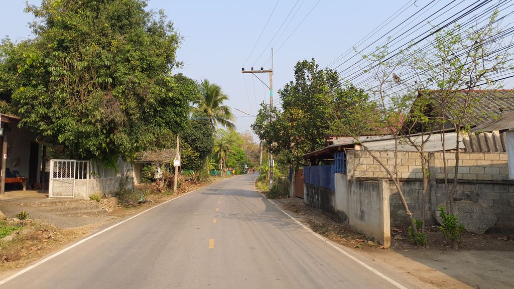 ภาพถนนตรงที่ บ้านท่าไม้ลุง หมู่ 7 ตำบลน้ำแพร่ ตั้งอยู่ ถ่ายโดย jrcarlsen พ.ศ. 2564 (2021) · A street-level view of where บ้านท่าไม้ลุง หมู่ 7 ตำบลน้ำแพร่ · Ban Tha Mai Lung Mu 7 Tambon Nam Phrae stands, by jrcarlsen in 2564 (2021)