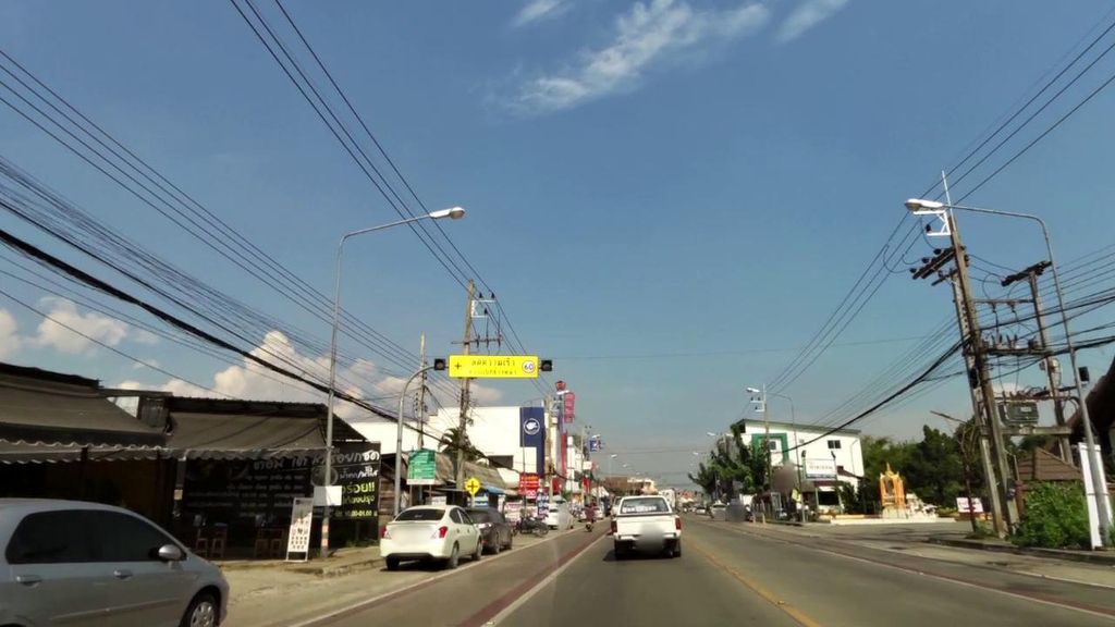 ภาพถนนตรงที่ ถ่านทอง โคขุนโพนยางคำ ตั้งอยู่ ถ่ายโดย toffy พ.ศ. 2561 (2018) · A street-level view of where ถ่านทอง โคขุนโพนยางคำ · Thanthong Khokhun Phonyangkham stands, by toffy in 2561 (2018)